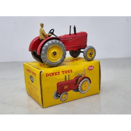 1324 - A boxed Dinky Toys No.300 Massey-Harris Tractor, G (transfers heavily worn), box Ex