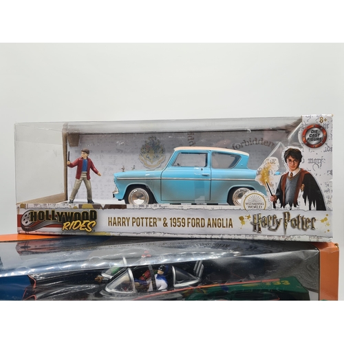 1395 - A boxed NJCroce Batmobile, a boxed Harry Potter Ford Anglia and a tray of unboxed diecast Ambulances