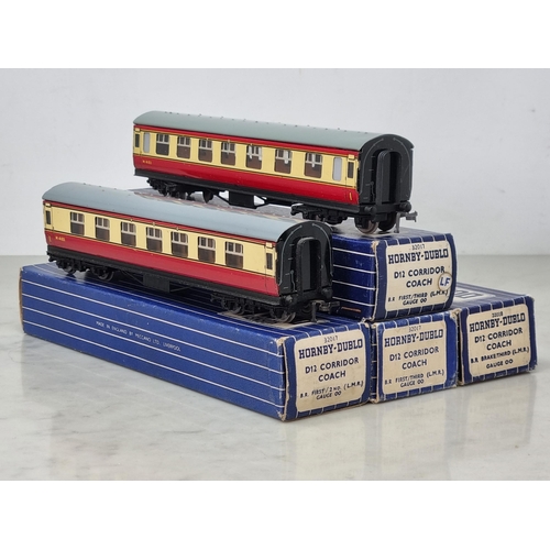 1024 - A rake of four boxed Hornby Dublo D12 Coaches comprising 3x 1/3rd and 1x Brake/3rd, all metal wheels... 