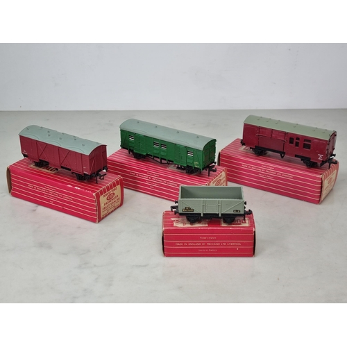 1039 - Four boxed Hornby Dublo Wagons including 4323 S.R. 4-wheel Utility Van, 4670 Standard Wagon, 4305 W.... 