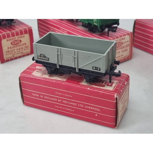 1039 - Four boxed Hornby Dublo Wagons including 4323 S.R. 4-wheel Utility Van, 4670 Standard Wagon, 4305 W.... 