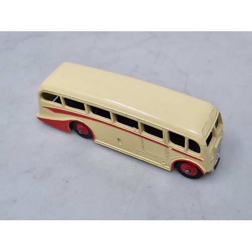 1018 - A Dinky Toys 281 Luxury Coach, rarer cream body with red flash and hubs, mint condition, ideal for t... 