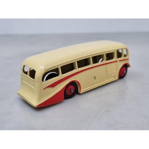 1018 - A Dinky Toys 281 Luxury Coach, rarer cream body with red flash and hubs, mint condition, ideal for t... 