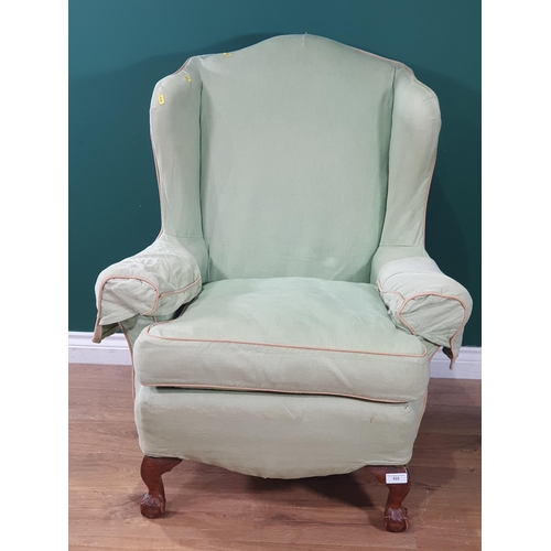 494 - A Georgian style wing back Easy Chair with pale green upholstery on dwarf cabriole legs with ball an... 