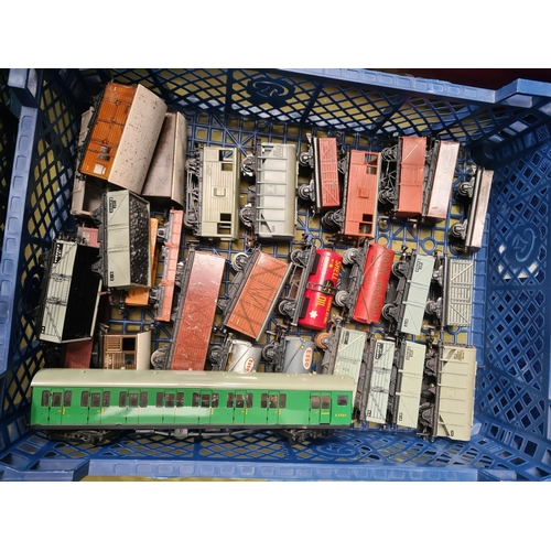 1099 - Two trays containing twenty unboxed Hornby Dublo and Trix Wagons and a S.R. Suburban Trailer Coach i... 