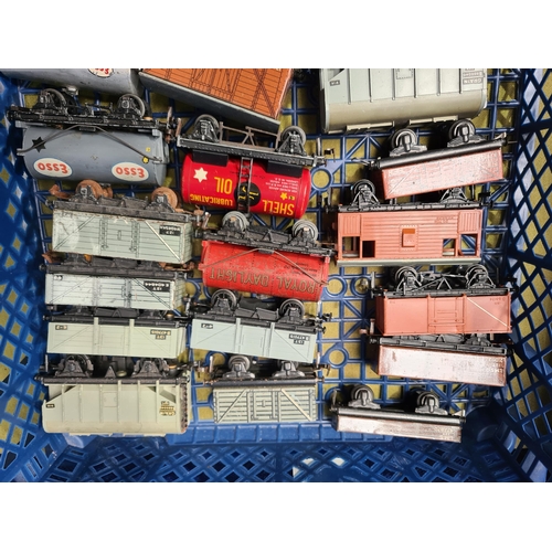 1099 - Two trays containing twenty unboxed Hornby Dublo and Trix Wagons and a S.R. Suburban Trailer Coach i... 