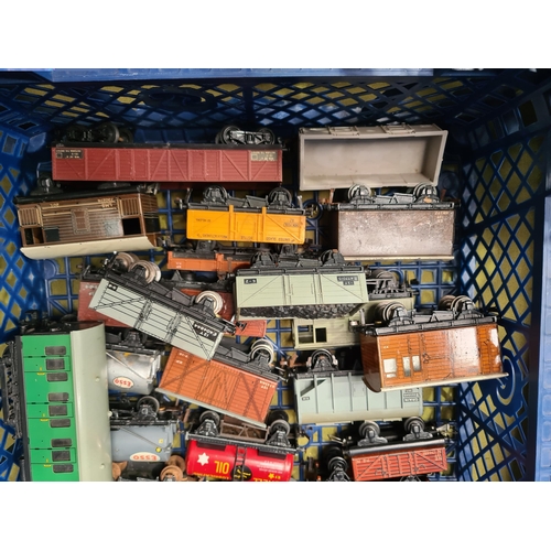 1099 - Two trays containing twenty unboxed Hornby Dublo and Trix Wagons and a S.R. Suburban Trailer Coach i... 