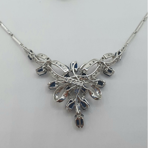 166 - A Sapphire and Diamond Necklace the front with openwork ribbon effect plaque claw-set step-cut sapph... 