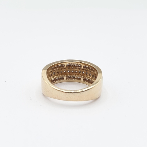 171 - A Diamond half Eternity Ring pavé-set two rows of eight-cut stones between rows of channel-set champ... 