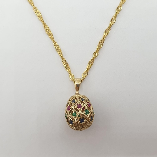 178 - A gem-set Egg Pendant and matching drop Earriings all set rubies, sapphires and emeralds in 9ct gold... 