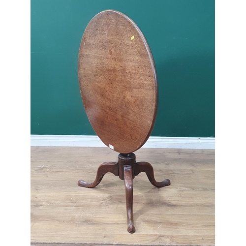 1 - An antique mahogany tilt top Tripod Table on turned column and shaped supports, A/F, 2ft 4