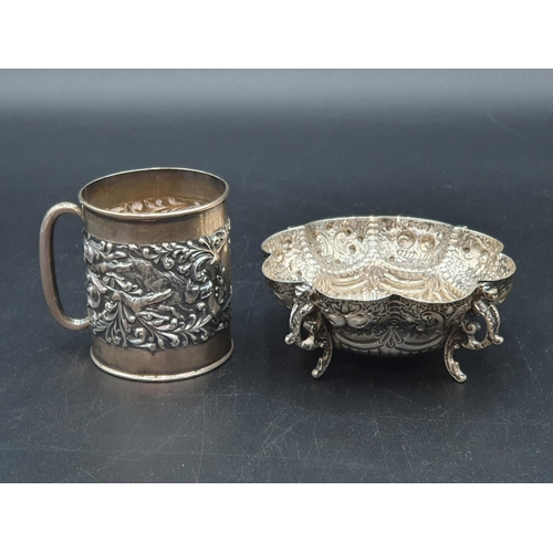 108 - An Edward VII small Mug embossed dogs and scrolls, Birmingham 1904, and an embossed lobed circular D... 