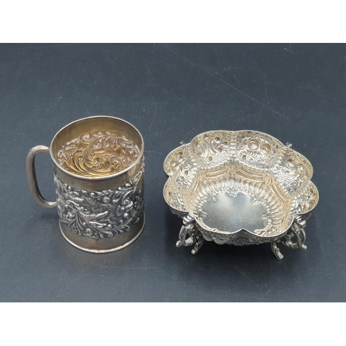 108 - An Edward VII small Mug embossed dogs and scrolls, Birmingham 1904, and an embossed lobed circular D... 