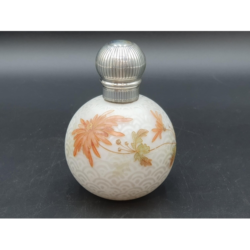 110 - A Victorian silver lidded opaline glass globular Scent Bottle with floral decoration on a cellular g... 