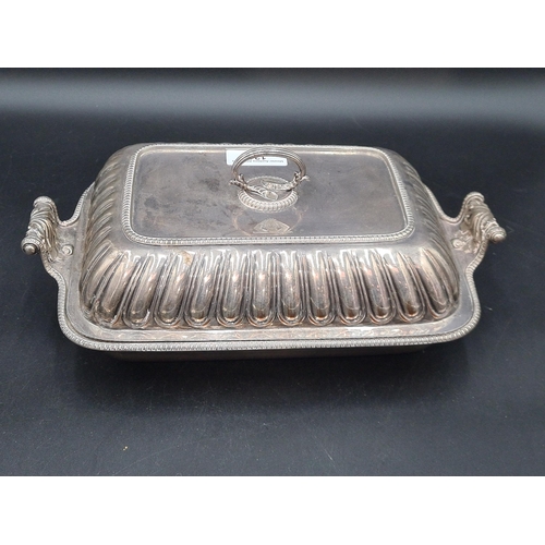 121 - An early 19th century Sheffield plated oblong Entree Dish and Cover engraved crest, leafage scroll h... 