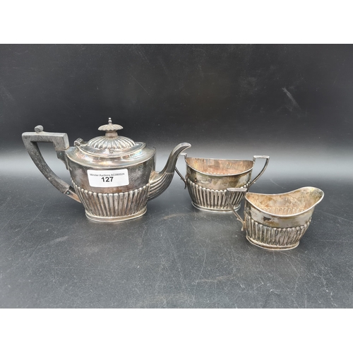 127 - A Victorian silver bachelor's three piece Tea Service of oval semi fluted form, Sheffield 1894, 400g... 