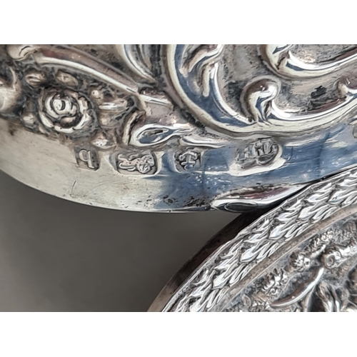 134 - An Edward VII silver oval Box embossed and chased three figures in a landscape, Birmingham 1901