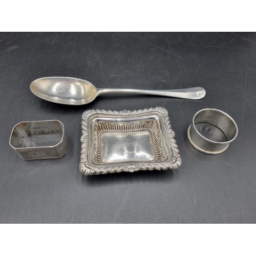 143 - A George V silver Table Spoon Hanoverian pattern with rat tail bowl, Sheffield 1935, a silver Trinke... 