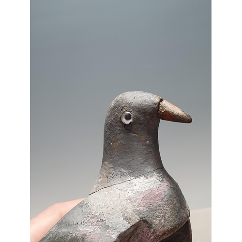 15 - A carved and painted Pigeon Decoy with glass eyes and spring underneath, A/F, and another painted Pi... 