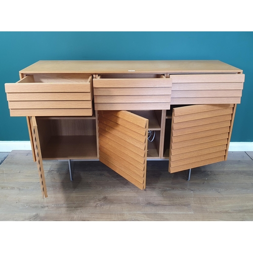 19 - A Terence Woodgate Sussex Plinth slatted Sideboard, with three fitted drawers, above three cupboard ... 