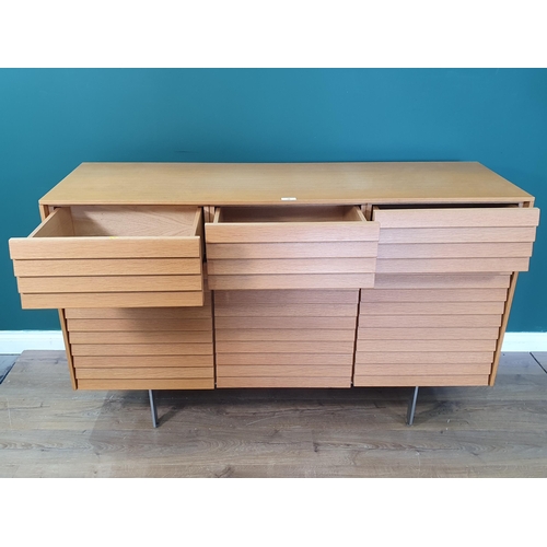 19 - A Terence Woodgate Sussex Plinth slatted Sideboard, with three fitted drawers, above three cupboard ... 