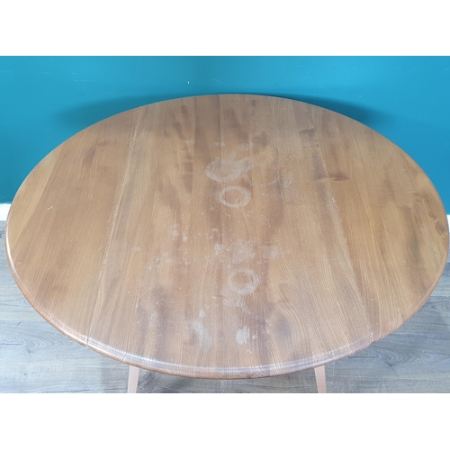 20 - An Ercol dropleaf Kitchen Table on splayed tapered supports,28in H x 49 in L x 45in W and a set of f... 