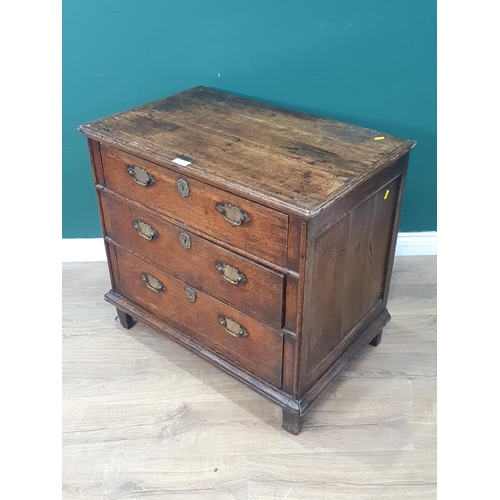 26 - An Early 18th Century oak Chest of three long graduated Drawers on square supports, 2ft 5in High x 2... 