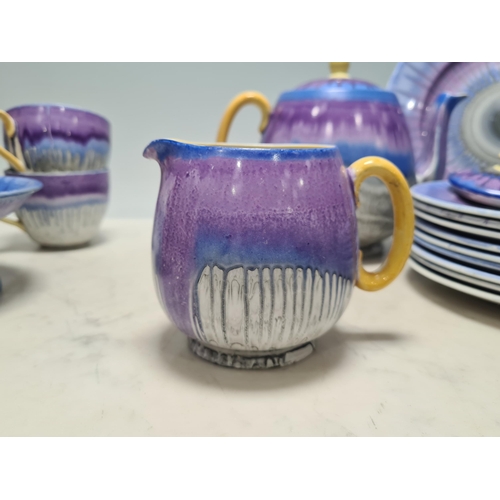 313 - A Shelley part Tea Service with drip glaze design in blue, mauve, and grey glazes, including Teapot ... 