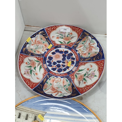 316 - An Imari Charger decorated panels of flowers and exotic birds, 14in diam and a pottery Charger depic... 