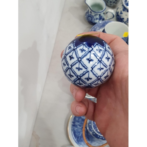 325 - A quantity of blue and white items including a tile, teaware, vases, teapots, etc (R5)