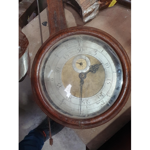 399 - An antique oak cased Waywiser Measuring Wheel, with circular brass and metal dial, and turned handle... 