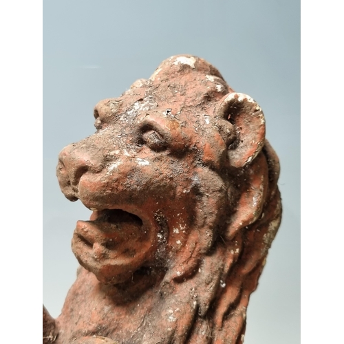 4 - A cast iron Seated Lion with octagonal base and rope twist style decoration, 14