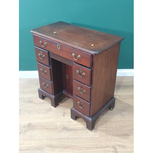 41 - An antique mahogany Kneehole Desk the moulded top above single long drawer, with single cupboard doo... 