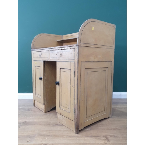 42 - A painted pine Washstand with shaped upstand fitted pair of long drawers over pair of panelled doors... 