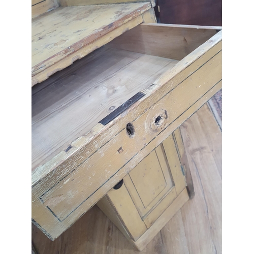 42 - A painted pine Washstand with shaped upstand fitted pair of long drawers over pair of panelled doors... 