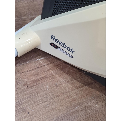 459 - A Reebok Exercise Bike and two Snowboards (R2)