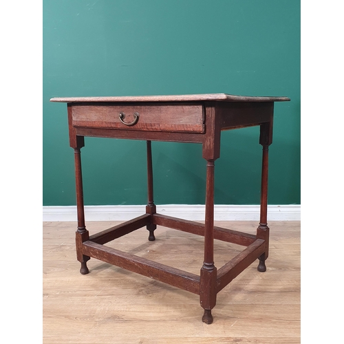 48 - An oak Side Table the square moulded top, above single fitted drawer, raised on turned and tapered s... 