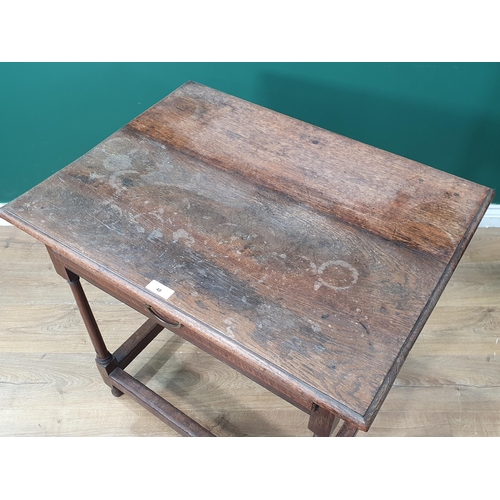 48 - An oak Side Table the square moulded top, above single fitted drawer, raised on turned and tapered s... 