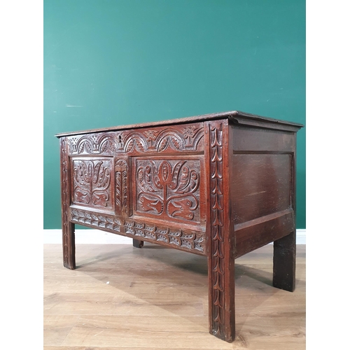 680 - A 17th Century West County Coffer with tulip carved panel front on stile supports, 2ft 5in H x 3ft 1... 