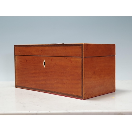 684 - A 19th Century satinwood Tea Caddy with crossbanded hinged cover and containing two compartments and... 