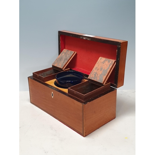 684 - A 19th Century satinwood Tea Caddy with crossbanded hinged cover and containing two compartments and... 