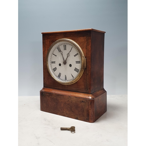 688 - A walnut cased Mantle Clock with brass inlaid decoration, white painted dial, label verso for Winter... 