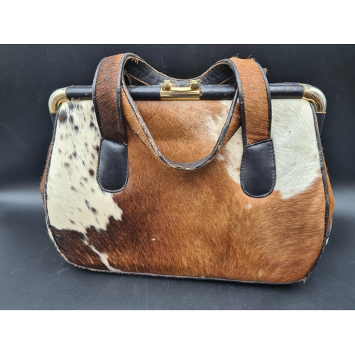 71 - An African skin covered Handbag, with photograph of owner, and an Osprey by Graeme Ellison, London, ... 