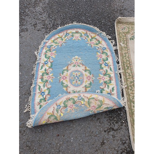 258 - A Chinese style blue ground oval Rug, a small Runner with green and floral designs and a small fring... 