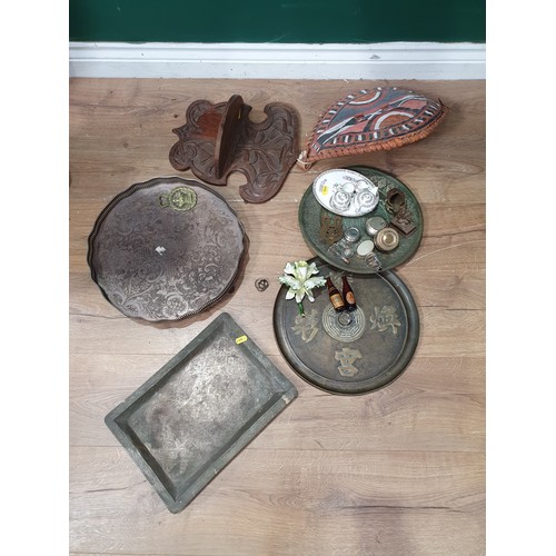 744 - A box of items including four Oriental metal Trays, miniature Tea Set, a Shield, a carved Wall brack... 