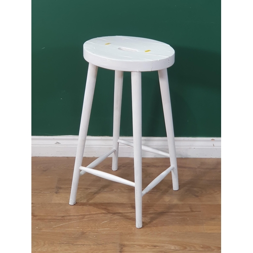 479 - A white painted Stool on tapered supports united by stretchers, 25