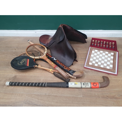 A leather Saddle, three Squash Rackets, a Tennis Racket, two Hockey ...