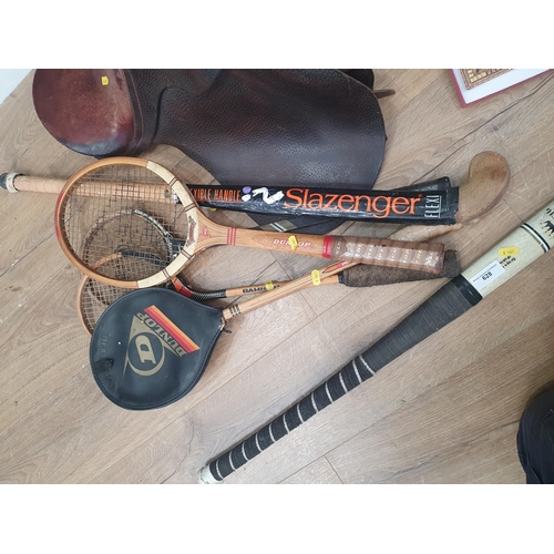 A leather Saddle, three Squash Rackets, a Tennis Racket, two Hockey ...