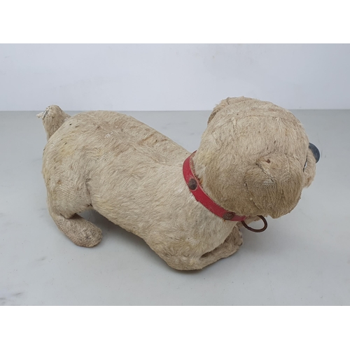 5 - An antique skin Dog Toy with glass eyes 8in L (R3)