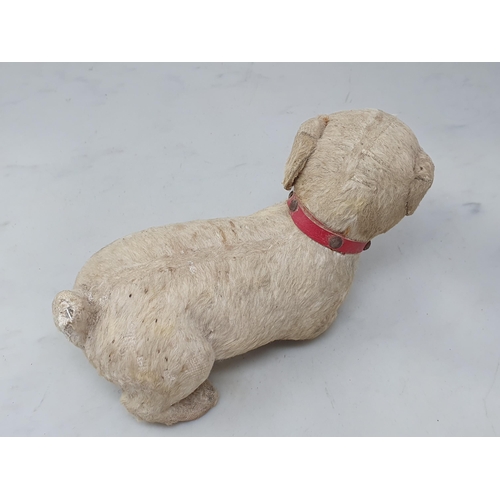 5 - An antique skin Dog Toy with glass eyes 8in L (R3)